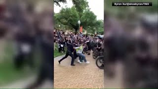 ProPalestine protesters at UT Austin confront officers on horseback [upl. by Alwitt]