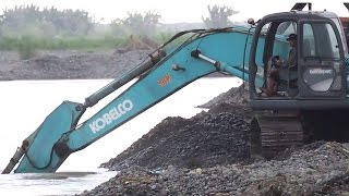 Excavator Kobelco SK200 Dredging Sand Loading Dump Truck [upl. by Kjersti]