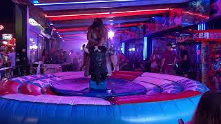 😍 4K TWO Pretty cowgirl riding mechanical bull riding 🔥 Benidorm Bull Riding 2024 😍 [upl. by Nimajeb]