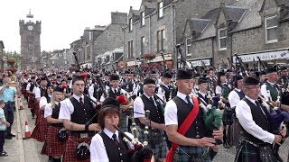 Chieftain leads almost 300 pipers amp drummers to the 127th Dufftown Highland Games in Moray Scotland [upl. by Mirielle814]