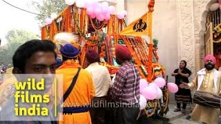 Sikh devotees participate in a procession during Gurpurab Ustav [upl. by Anett]