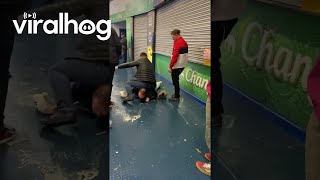 Two Men Slip And Slide On Wet Floors  ViralHog [upl. by Newcomer]