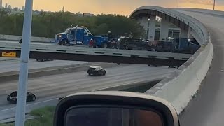 😮 This load was inches from hitting cars below Flatbed Roll over in Houston Tx [upl. by Corinne]