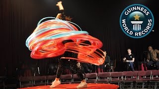 SPOTLIGHT  Most hula hoops spun simultaneously [upl. by Bergin]