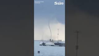 Eerie moment two waterspouts swirl off the coast of Indonesia shorts [upl. by Oileduab]