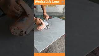 A skilled artisan cuts a precise hole in a floor tile with an angle grinder for pipe installation [upl. by Wilden341]