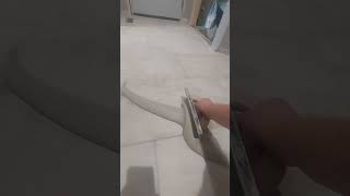 Spreading Grout over Tile tiled flooring renovation construction skills [upl. by Manoop]