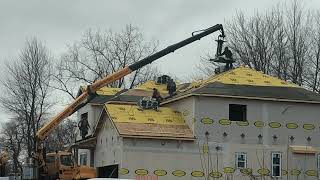 Crane Delivering Shingles To The Top Of A Roof [upl. by Sascha]