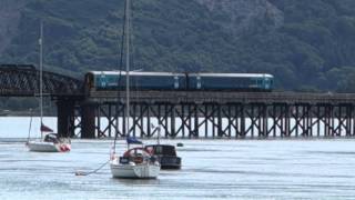 Barmouth Wales Arriva train DMU crosses River Mawddach Bridge 31 July 2015 [upl. by Keefer]