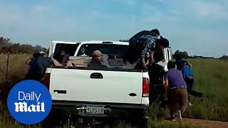 Dozens of migrants leaps out of pickup truck during police stop [upl. by Ruel710]