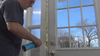 Using Spray Foam Insulation to seal a door frame [upl. by Tterraj147]