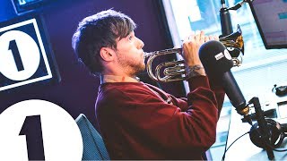 Louis Tomlinson plays trumpet and talks Tobey Maguire Niall and Pelé [upl. by Gnehp]