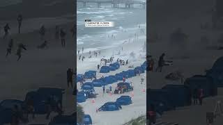 Waterspout tosses chairs and umbrellas on Florida beach  AccuWeather [upl. by Eisnil245]