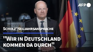 Scholz in Neujahrsansprache quotWir kommen da durchquot  AFP [upl. by Wolgast543]