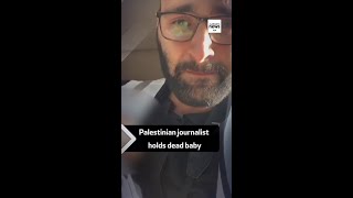 Palestinian journalist holds baby killed in Israeli strike [upl. by Baptist]