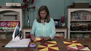 How to Make a Pinwheel Quilt Block  National Quilters Circle [upl. by Lail]