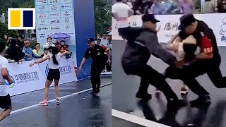 Quickthinking security guard catches collapsing marathon runner [upl. by Obellia]