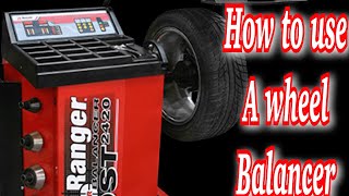 How to use a wheel balancer [upl. by Asilanom]