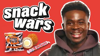 Arsenal Star Bukayo Saka Rates British And Nigerian Food  Snack Wars [upl. by Anaiviv747]