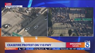 Breaking News Antiwar protesters block freeway in downtown LA [upl. by Aikrehs]