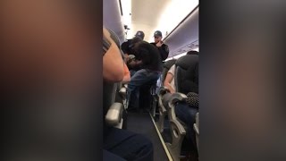 Video shows a passenger forcibly dragged off a United Airlines plane [upl. by Thirza]