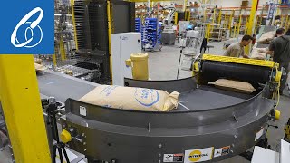 High Speed Robotic Bag Palletizer System with a Bag Flattener and Curved Infeed Conveyor [upl. by Eelano]