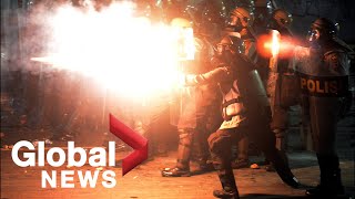 Indonesia riots Tear gas fire erupts as protesters clash with police in Jakarta [upl. by Roselle613]