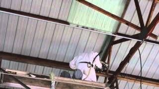 Closed cell Spray foam insulation being applied to a auto shop [upl. by Ilhsa986]