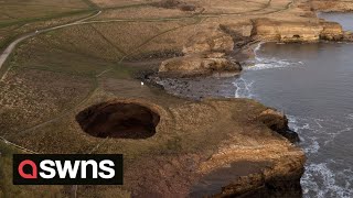 Drone footage shows a massive sinkhole revealing a hidden underground beach  SWNS [upl. by Leahicm841]