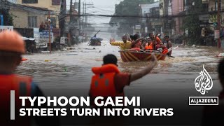 Streets turn into rivers as Typhoon Gaemi sweeps over Philippines [upl. by Aznofla410]