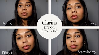 Clarins Lip Comfort Oil Swatches on Tan Skin  Honey Cherry Pitaya and Strawberry [upl. by Atinnod674]