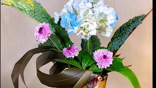 Hydrangeas and chrysanthemum with phormium leaves floral design tutorial [upl. by Yellah]