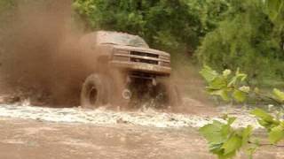 EPIC HUGE CHEVY 4X4 MUD TRUCK BLASTING THROUGH SLOUGH at Red River Mud Bog [upl. by Wehhtam214]