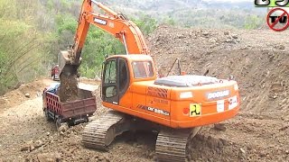 Excavator Doosan DX225LCA Filling Dirt Into Dump Truck [upl. by Matrona]