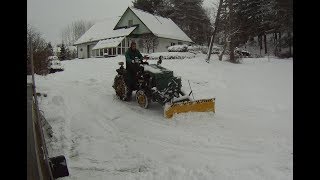 homemade tractor with power angle snow plow [upl. by Ennayr]