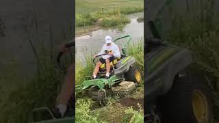 JOHN DEERE ZERO TURN MOWER SLIDING INTO A CREEK lawncare johndeere viralvideo mowing [upl. by Carver]