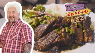 Guy Fieri Eats quotOutofBoundsquot Kalbi Short Ribs  Diners Driveins and Dives  Food Network [upl. by Koenig]