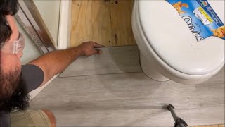 how to cut laminate vinyl FLOORING around toilet doors bath cabinets ANYTHING easy DIY [upl. by Inaej]