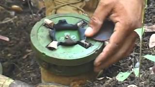 Cambodian shows how to disarm a mine [upl. by Rawden]