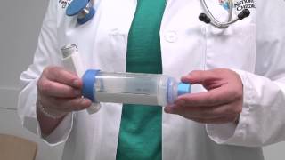 Asthma howto How to use an inhaler with a spacer and mouthpiece [upl. by Anaicilef]