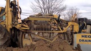 Heger Drainage Installing Field Tile [upl. by Mairim913]