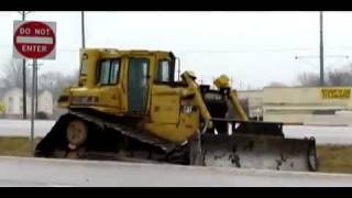 Bulldozer slides off trailer [upl. by Sremlahc]