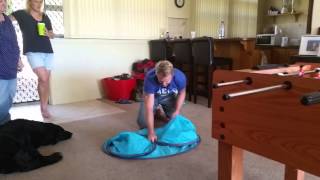 Folding a pop up beach tent [upl. by Znarf]