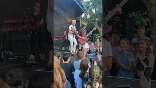 Cant believe this happened 🤯 10 year old asks band at festival to let him play guitar [upl. by Rasaec]