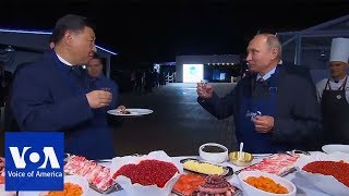 Putin and Xi make pancakes  VOANews [upl. by Yennaiv]