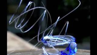 Melting Glass with the sun n Fresnel Lens to make glass springs with sun power [upl. by Glaser]