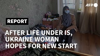 After life under IS Ukraine woman hopes for new start  AFP [upl. by Decca]