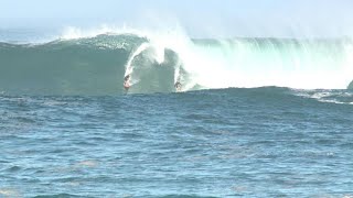 WATCH Surfers charge huge waves at Waimea Bay Peahi [upl. by Arocet208]