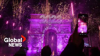 New Years 2023 Paris France gets the party started with fireworks smoke show over Arc de Triomphe [upl. by Decato437]