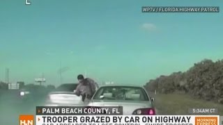 Yikes Trooper grazed by car on busy highway [upl. by Yeltihw]